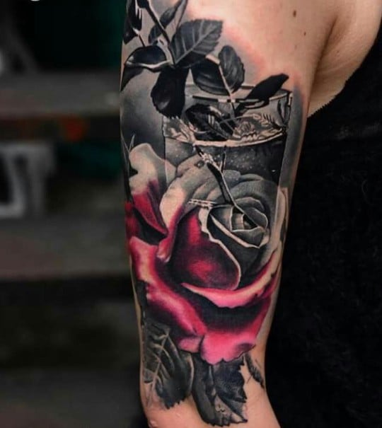 black and gray rose tattoo with pop of color