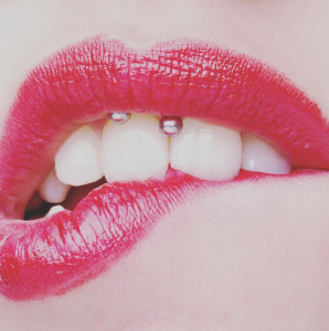 Biting lip piercing