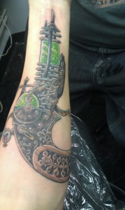scifi gun forearm tattoo