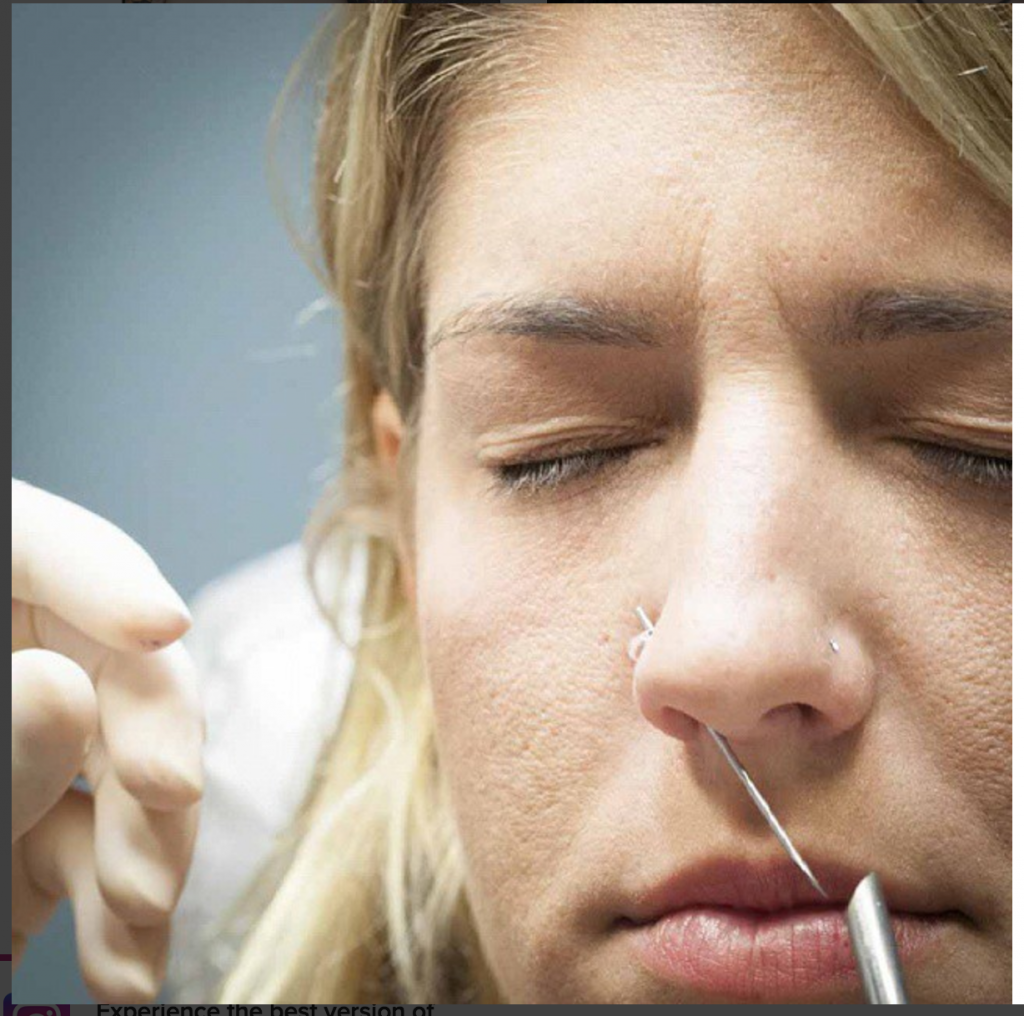 girl getting her nose pierced