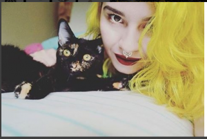 Girl with cat and septum piercing