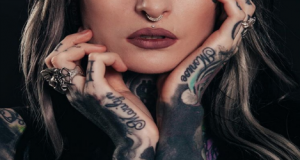 Medusa and septum piercing with tatoos