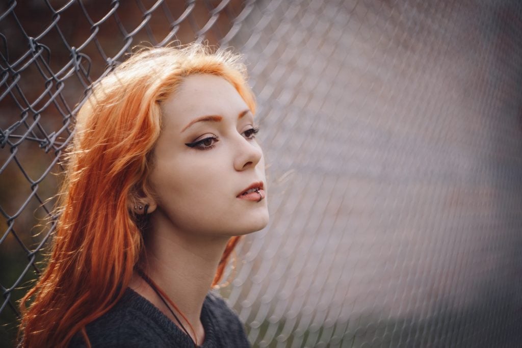 Girl with labret hoop piercing