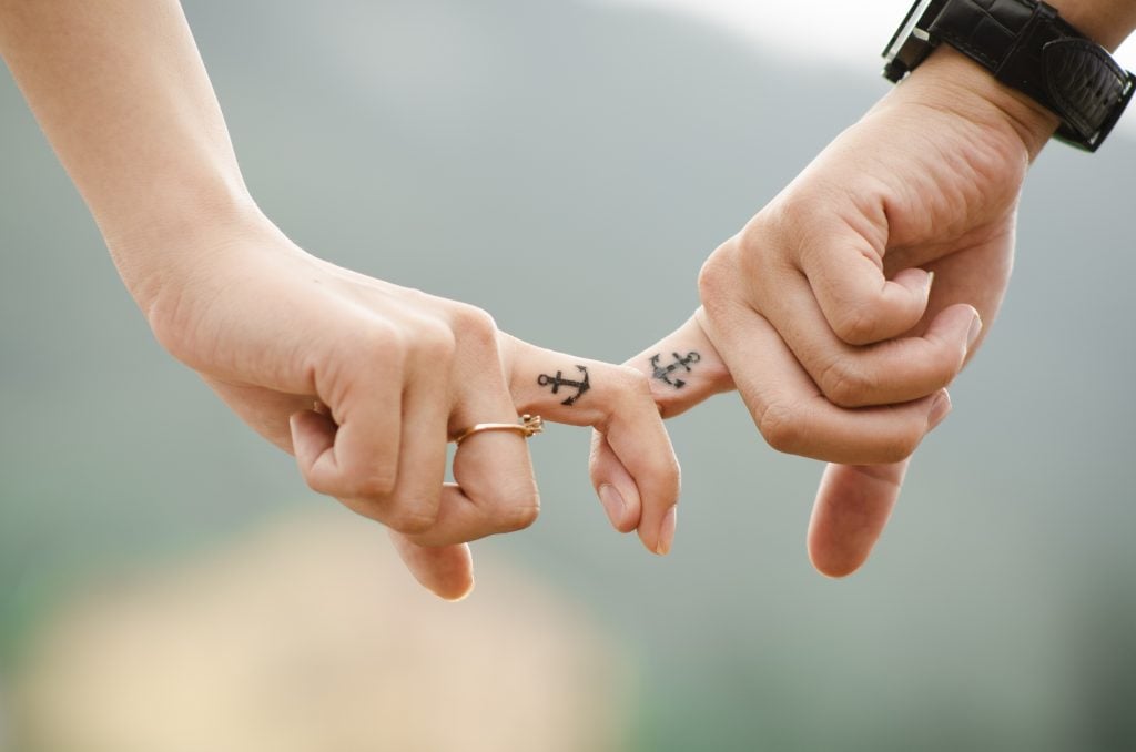 Couples anchor finger tattoo
