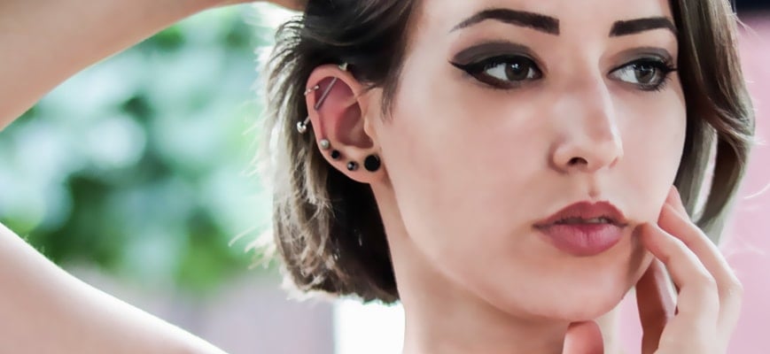 Woman with multiple ear piercings