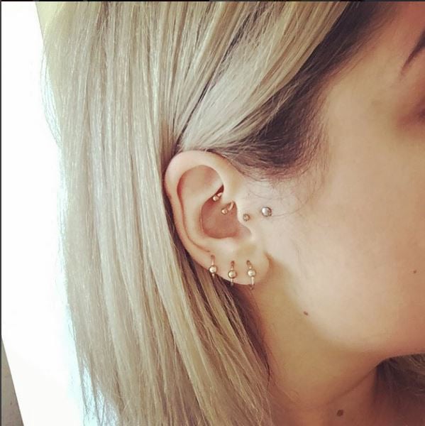 Girl with multiple cartilage piercings with FreshTrends jewelry