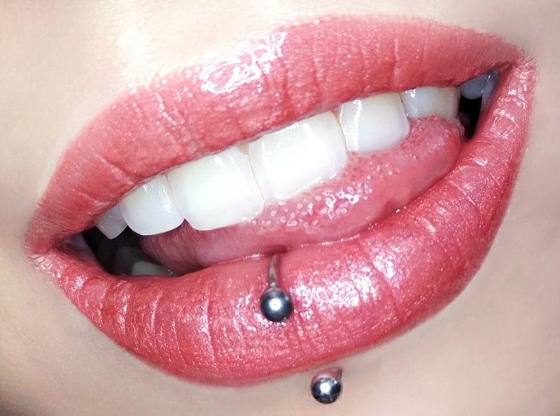 Woman wearing a circular barbell in her lip piercing
