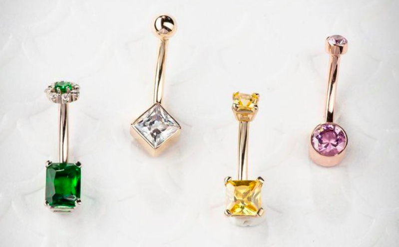 four colorful gemstone belly rings by FreshTrends