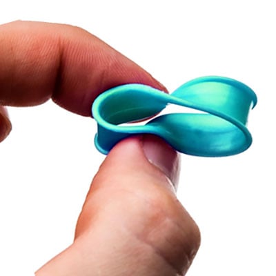 Hands demonstrating the flexibility of silicone plugs
