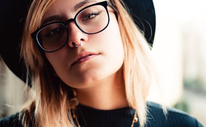 Blonde hair woman with septum piercing