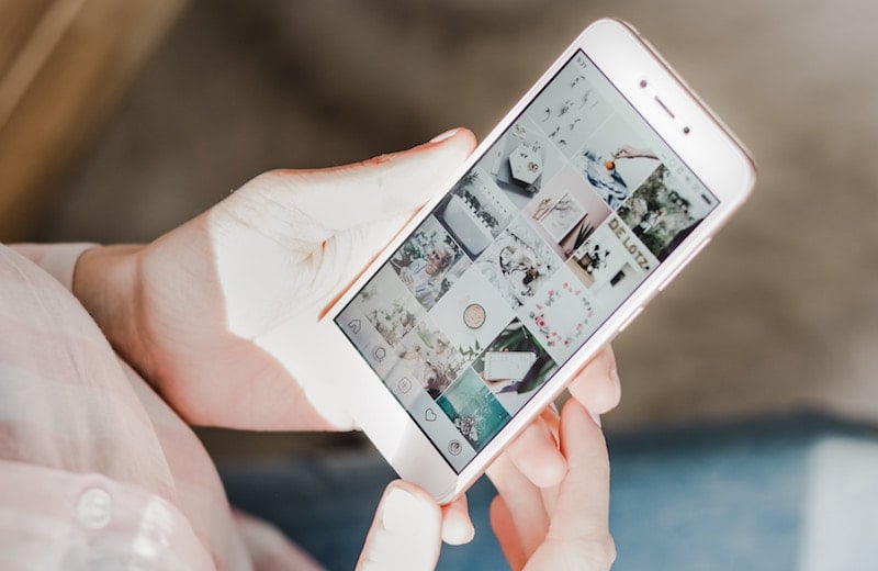 girl browses social media on cell phone