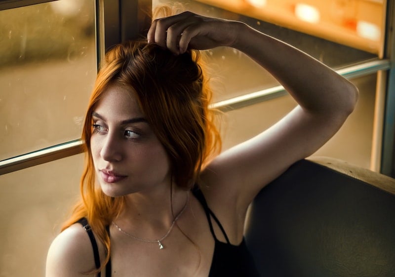 girl on bus looking out window