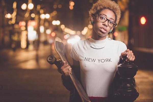 woman with nipple piercings through t-shirt