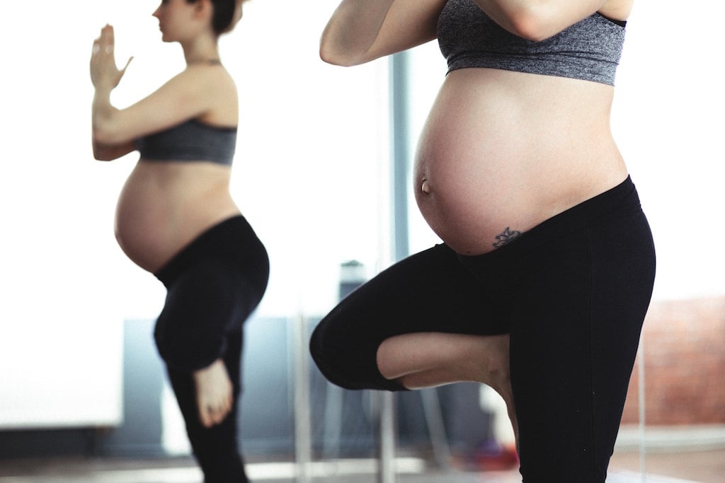 Pregnant woman doing yoga