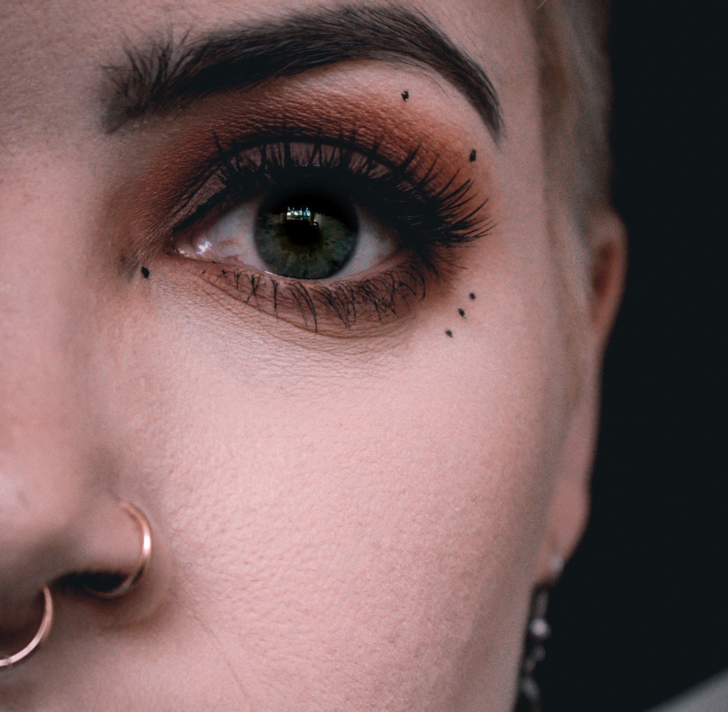 Close Up of Woman with Septum and Nostril Piercings