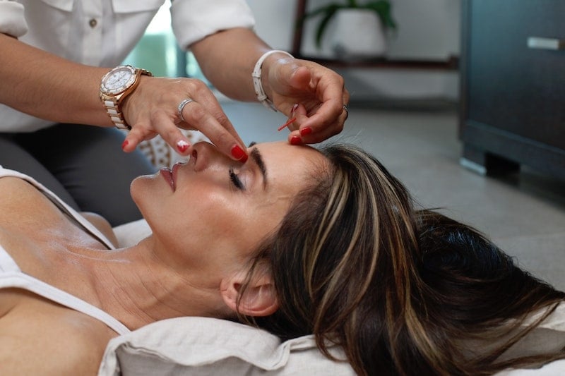 woman doing acupuncture