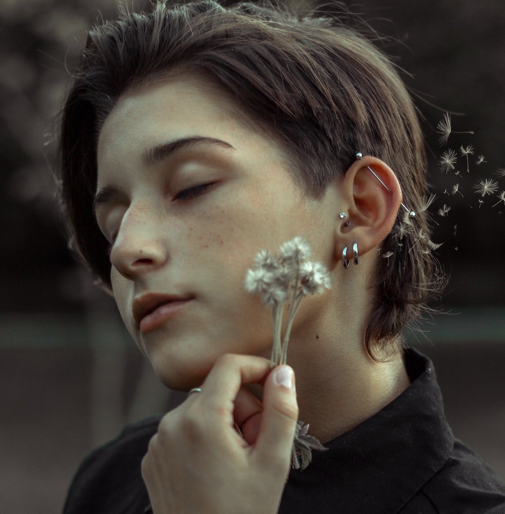 woman with multiple ear piercings