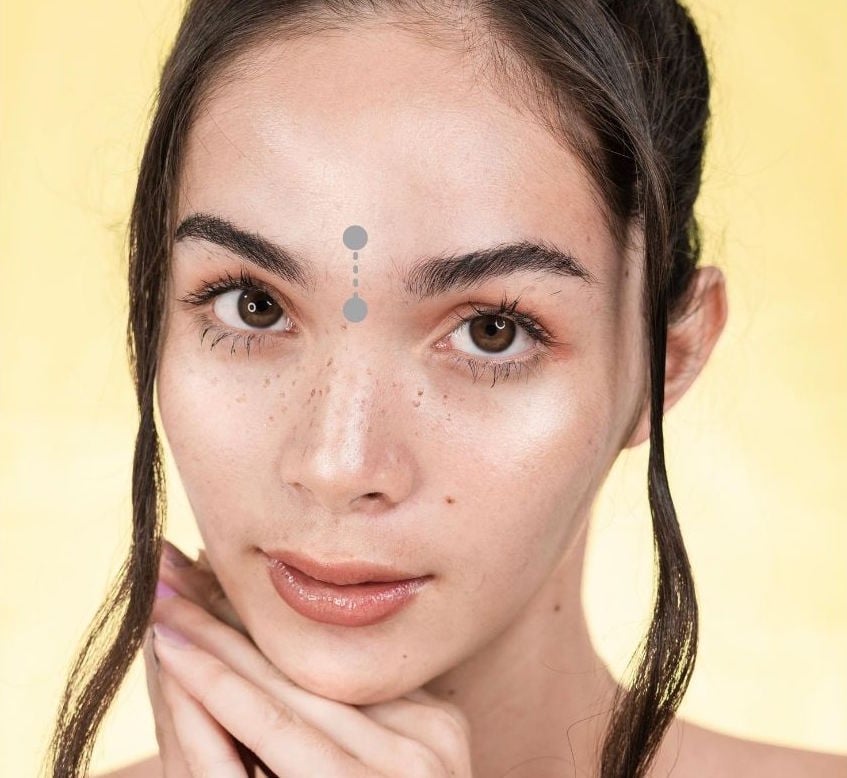 woman with third eye piercing