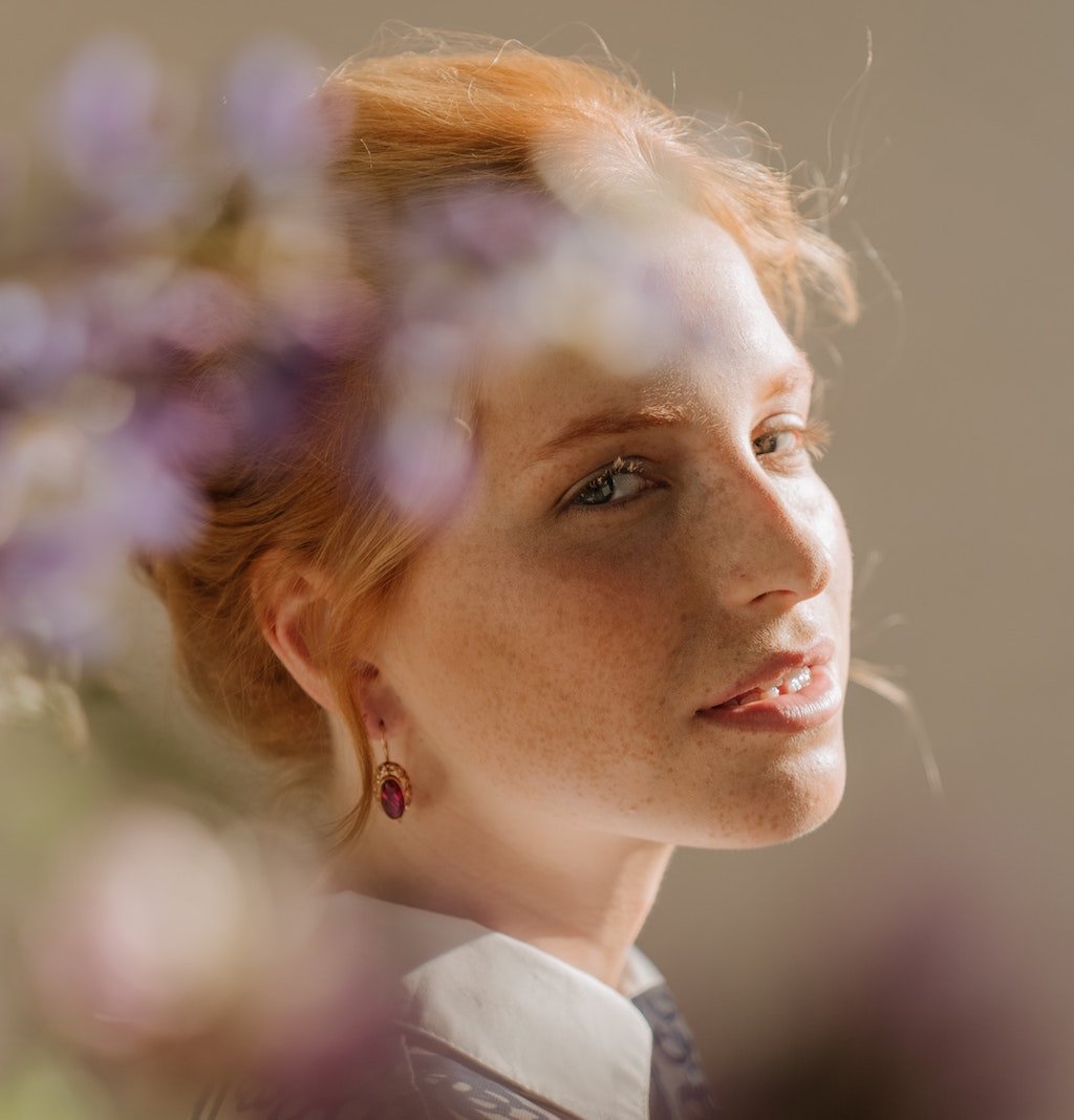 woman with garnet earrings