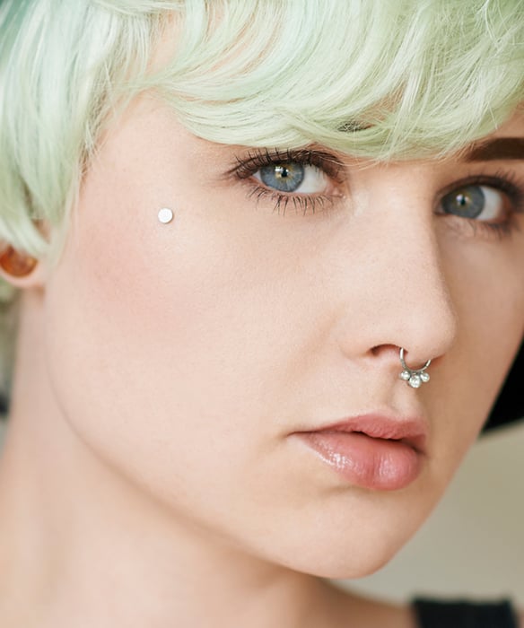 Facial dermal piercing