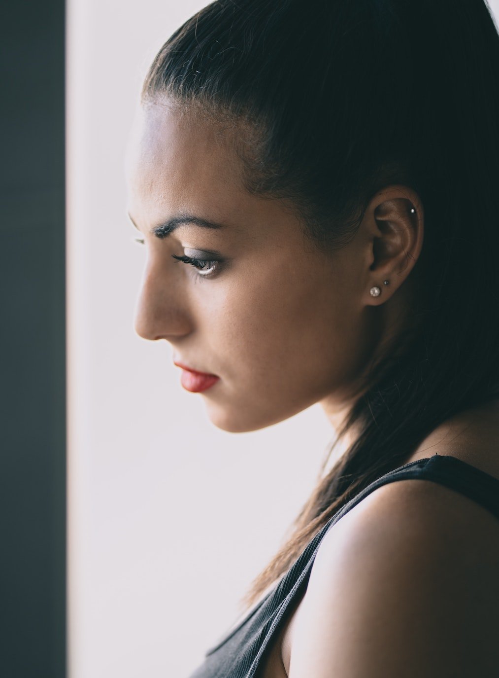 Woman with cartilage piercings