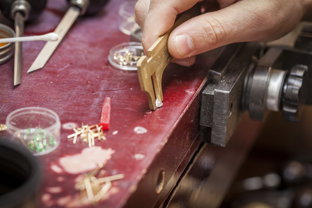Jeweler creating jewelry item by hand
