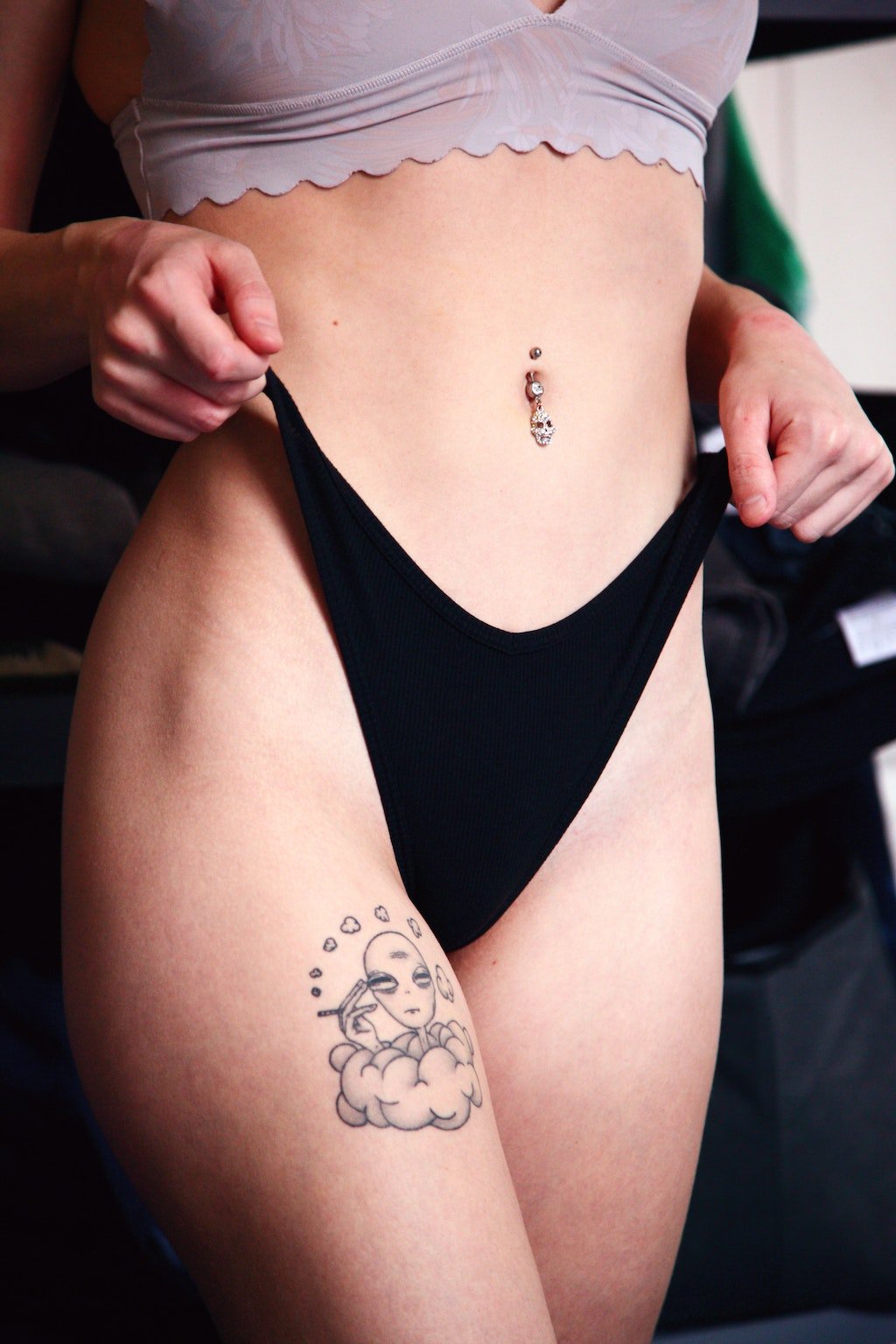 Woman with Tattoo and Belly Piercing