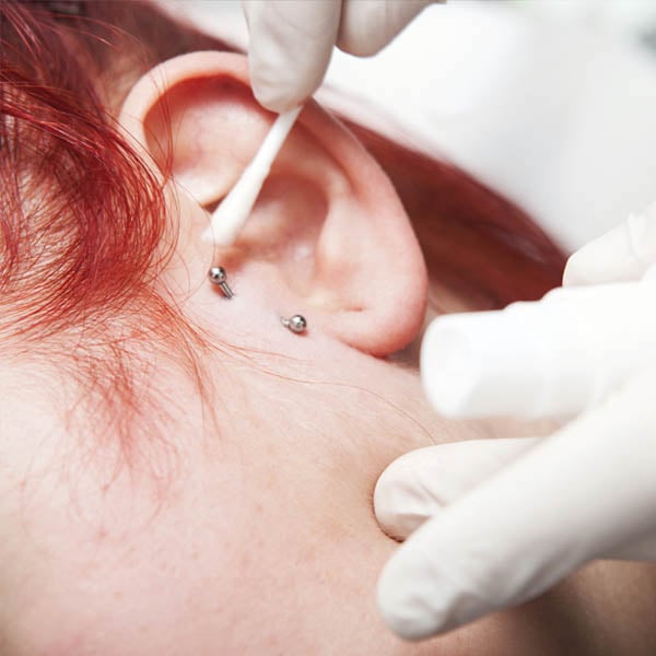 surface tragus piercing