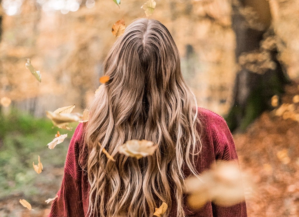 Woman with falling leaves