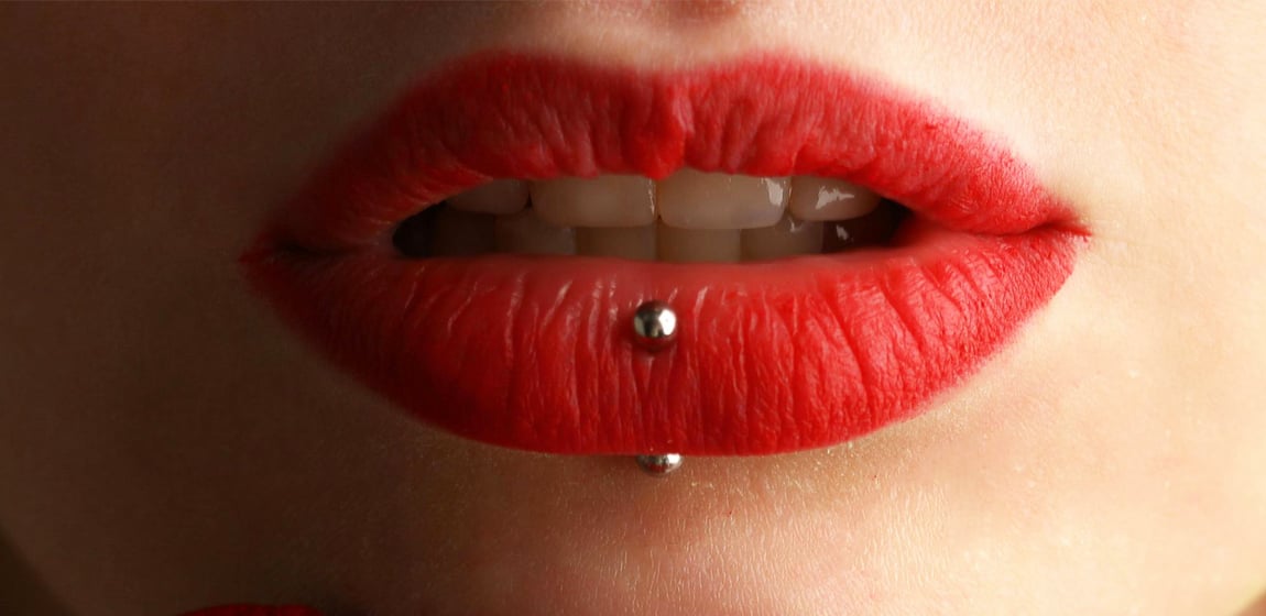Red lips with piercing