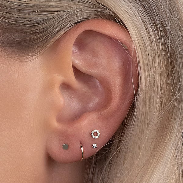 Multiple earrings on lobe