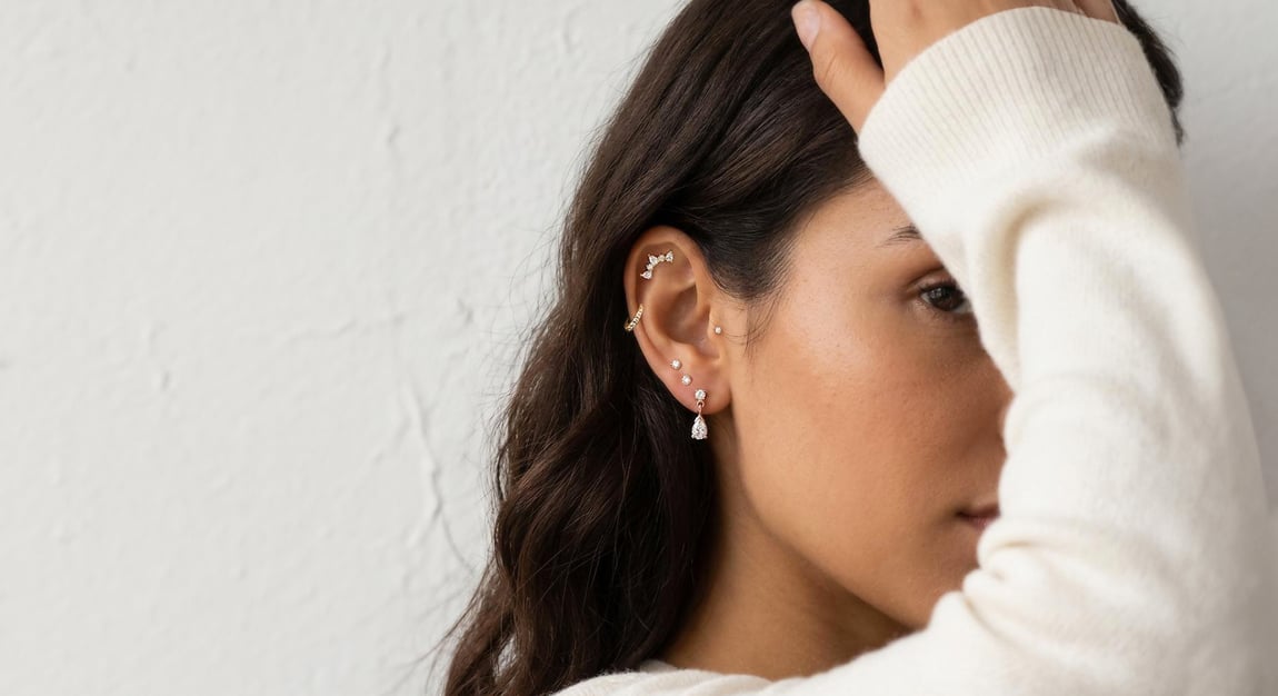 Model with multiple ear piercings